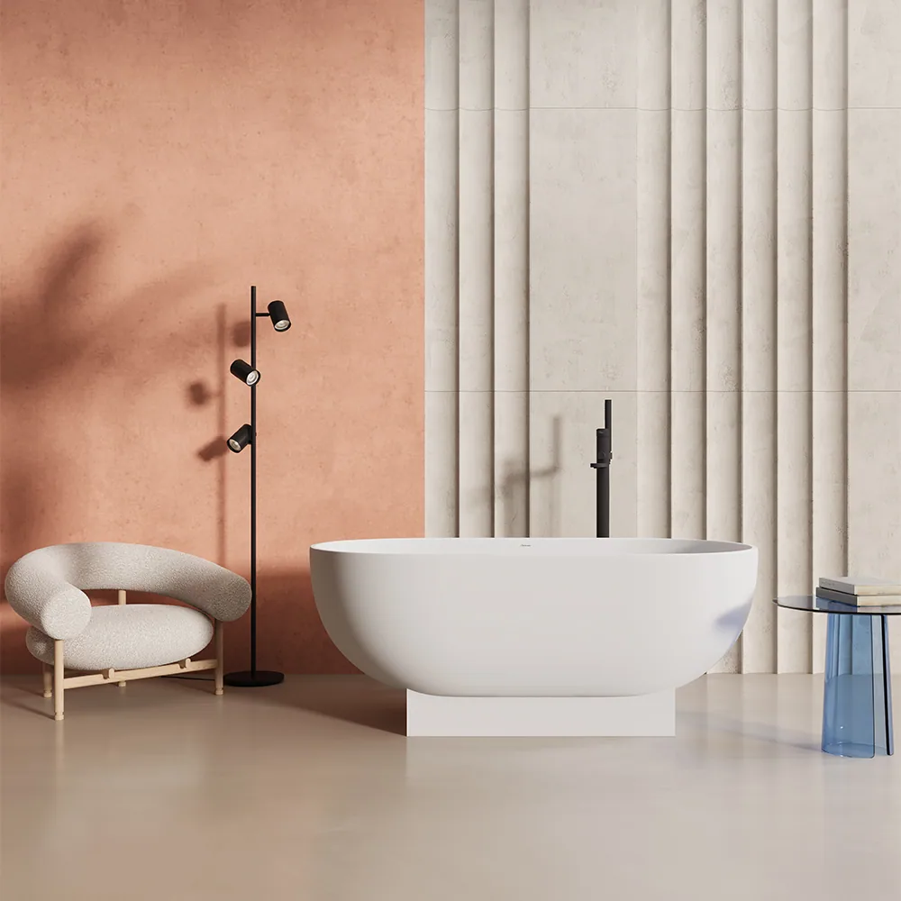 Artemis Ikaros freestanding solid-surface bathtub against a terracotta wall