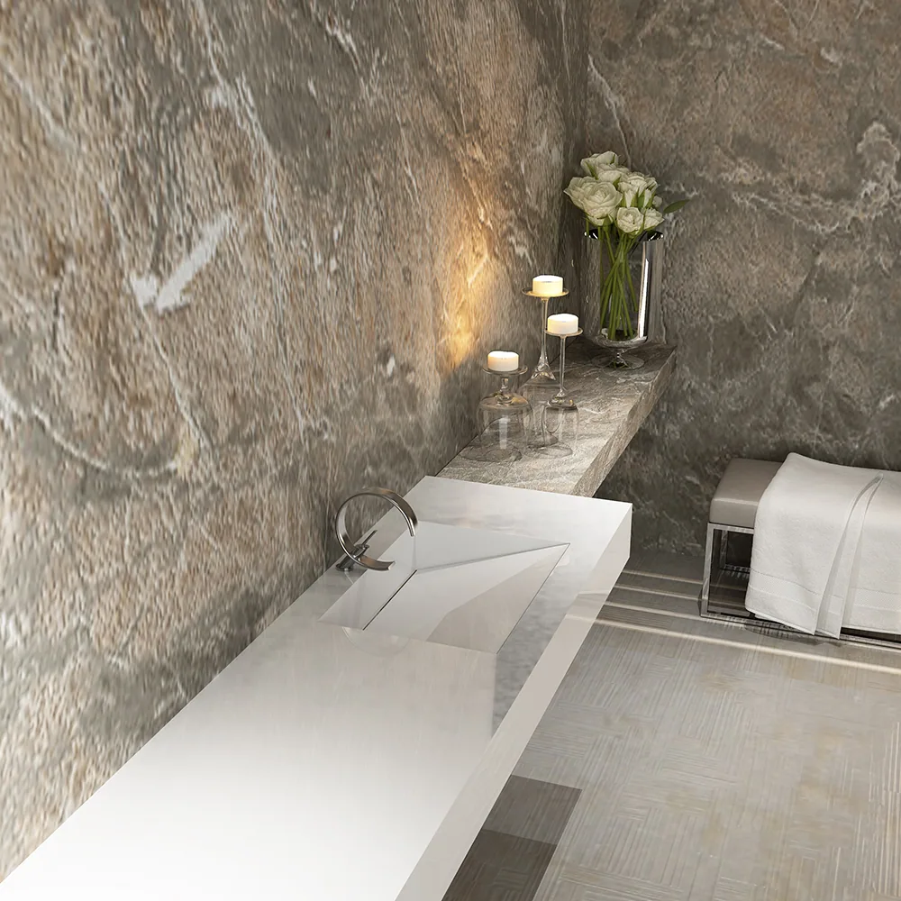 Artemis Sentinus solid-surface washbasin against a dark stone wall