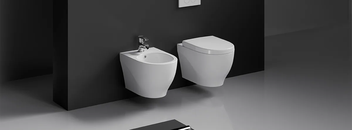 Creavit Mare wall-hung pan and bidet against a dark wall